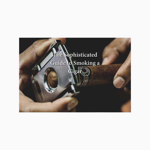 cigar cutter cutting a cigar with text saying guide to smoking a cigar